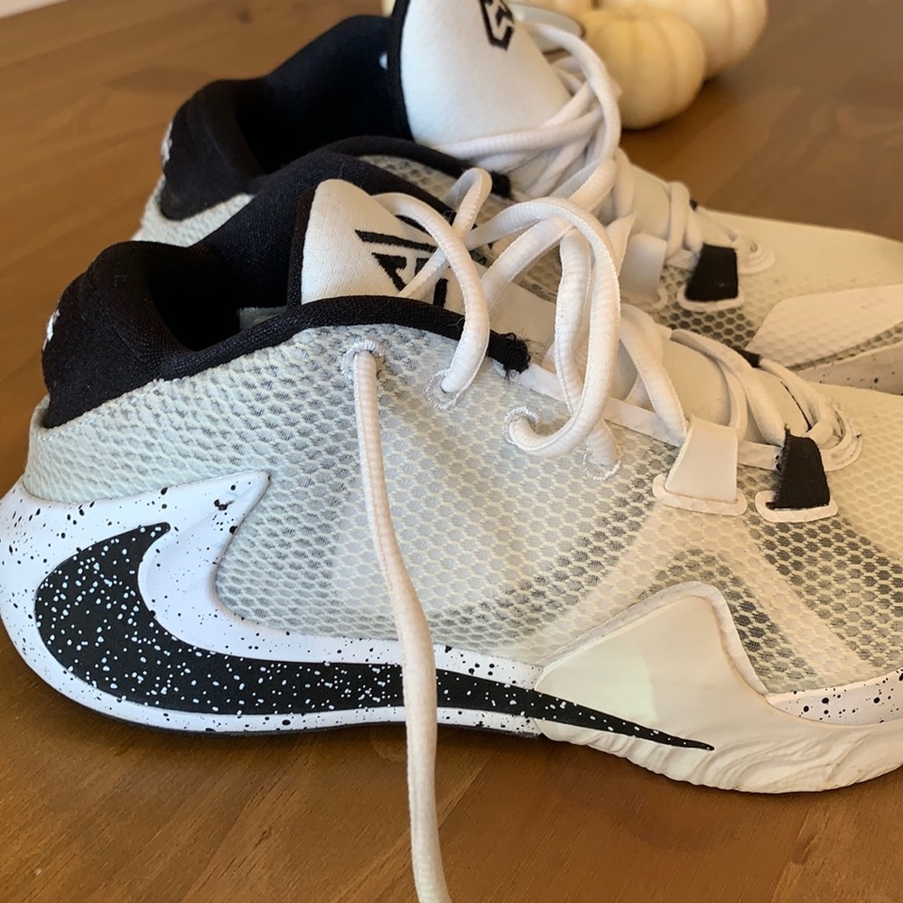 Previously loved.  Gently used Nike Basketball Sneaker .